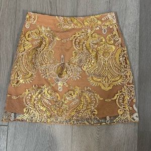 Sequin style mini skirt from forever 21. Inner lying is pleather, with a zipper.